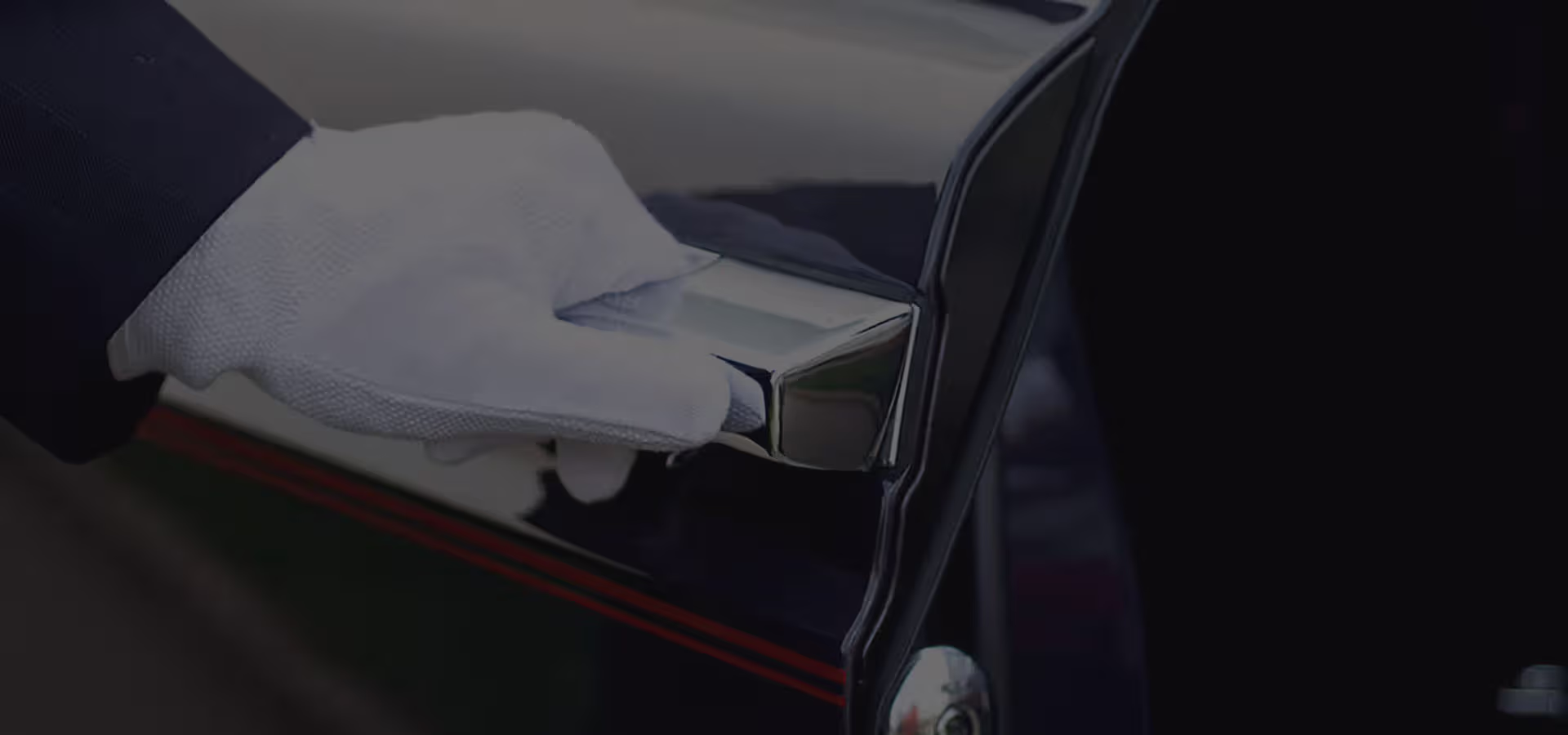 Chauffeured car waiting curbside at Terminal C arrivals, Boston Logan International Airport