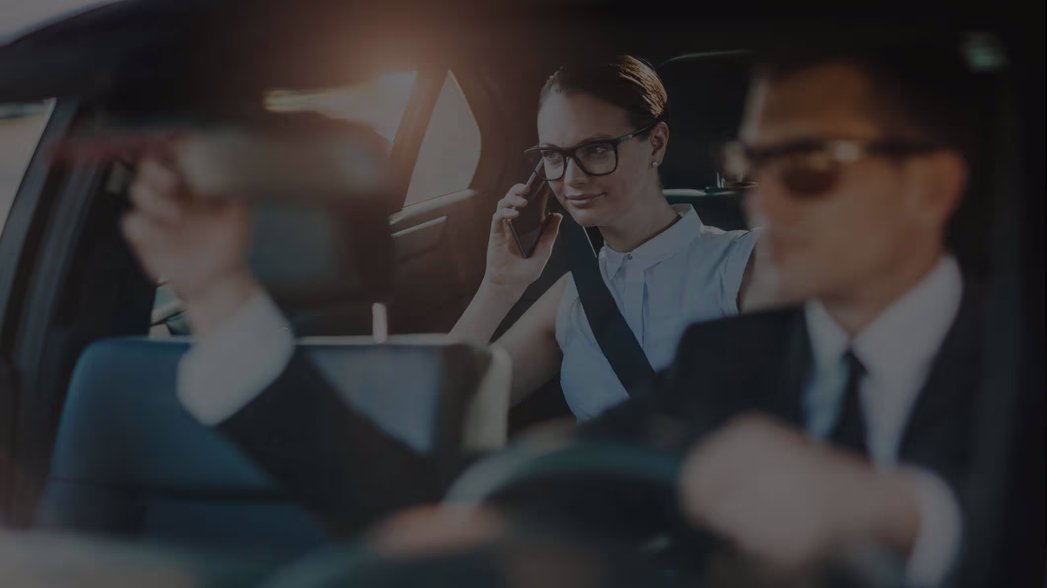 Professional limousine Chauffeur driving a corporate client to Woodstock VT from Boston Logan airport